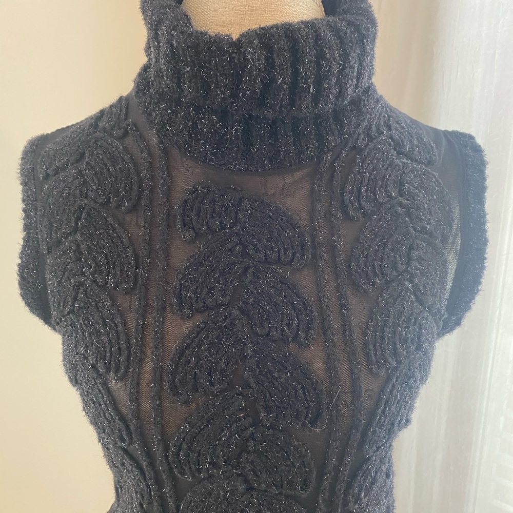 Black Cowl Turtleneck Sweater with Intricate Knit on Sheer Background
